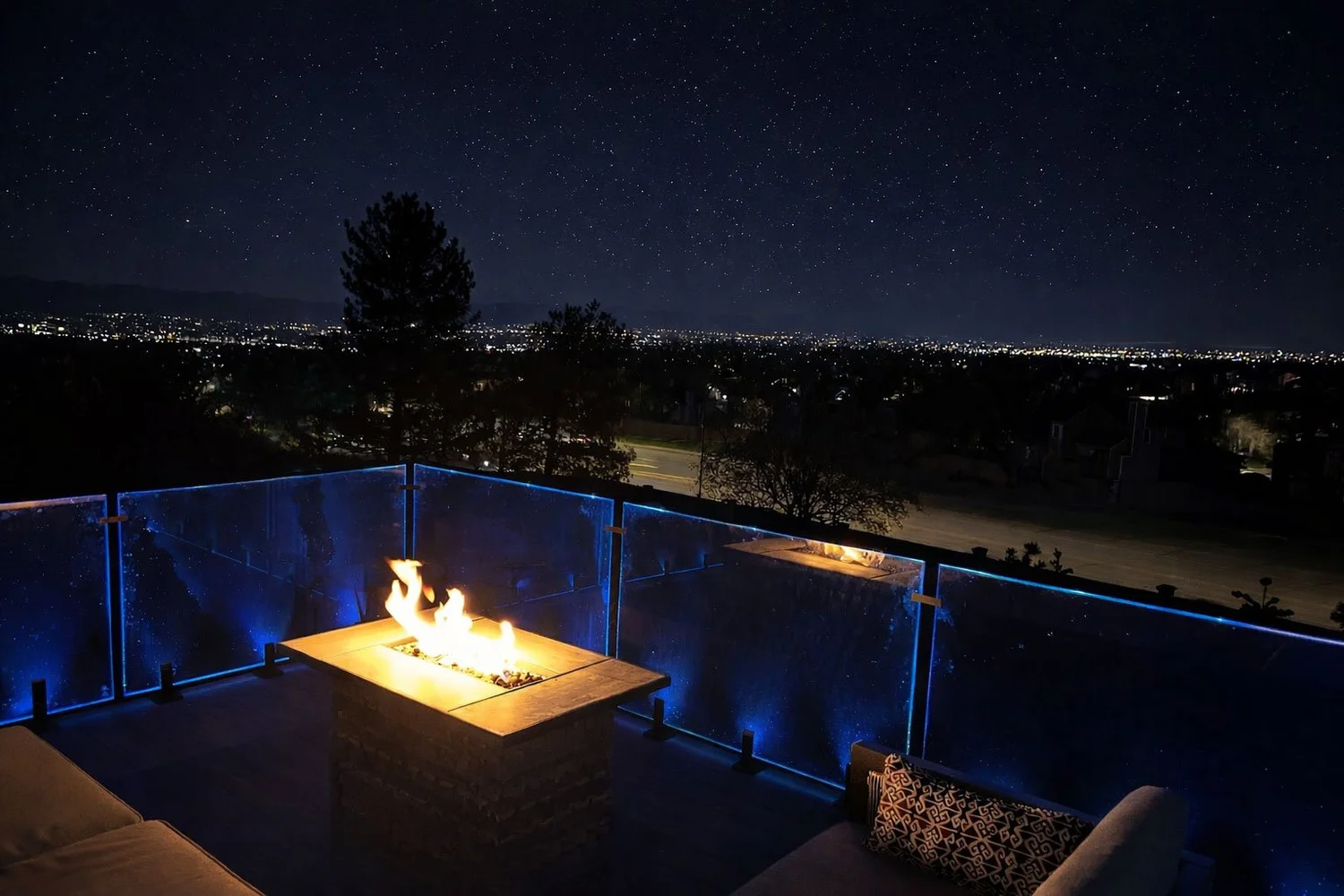 Rooftop fire feature overlooking the Front Range at night